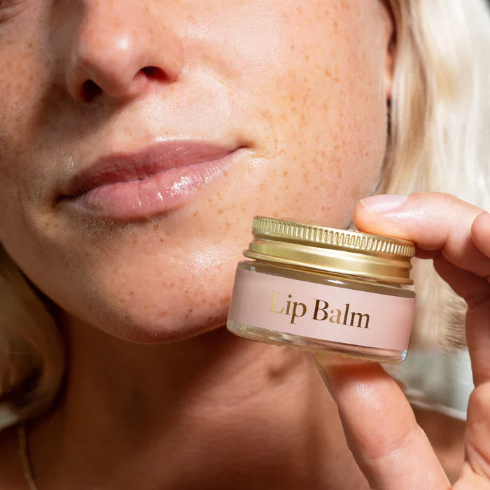 Transform your daily self-care ritual with our Australian-made natural Lip Balm. Thoughtfully crafted with premium hydrating ingredients including nourishing shea butter, antioxidant-rich sunflower and olive oils, and a hint of vanilla bean for a sweet touch. The sustainable glass packaging houses a gentle formula where pure beeswax and natural Vitamin E create a breathable moisture barrier that protects and soothes dry lips. Embrace this mindful moment of natural lip care that leaves your lips soft, health