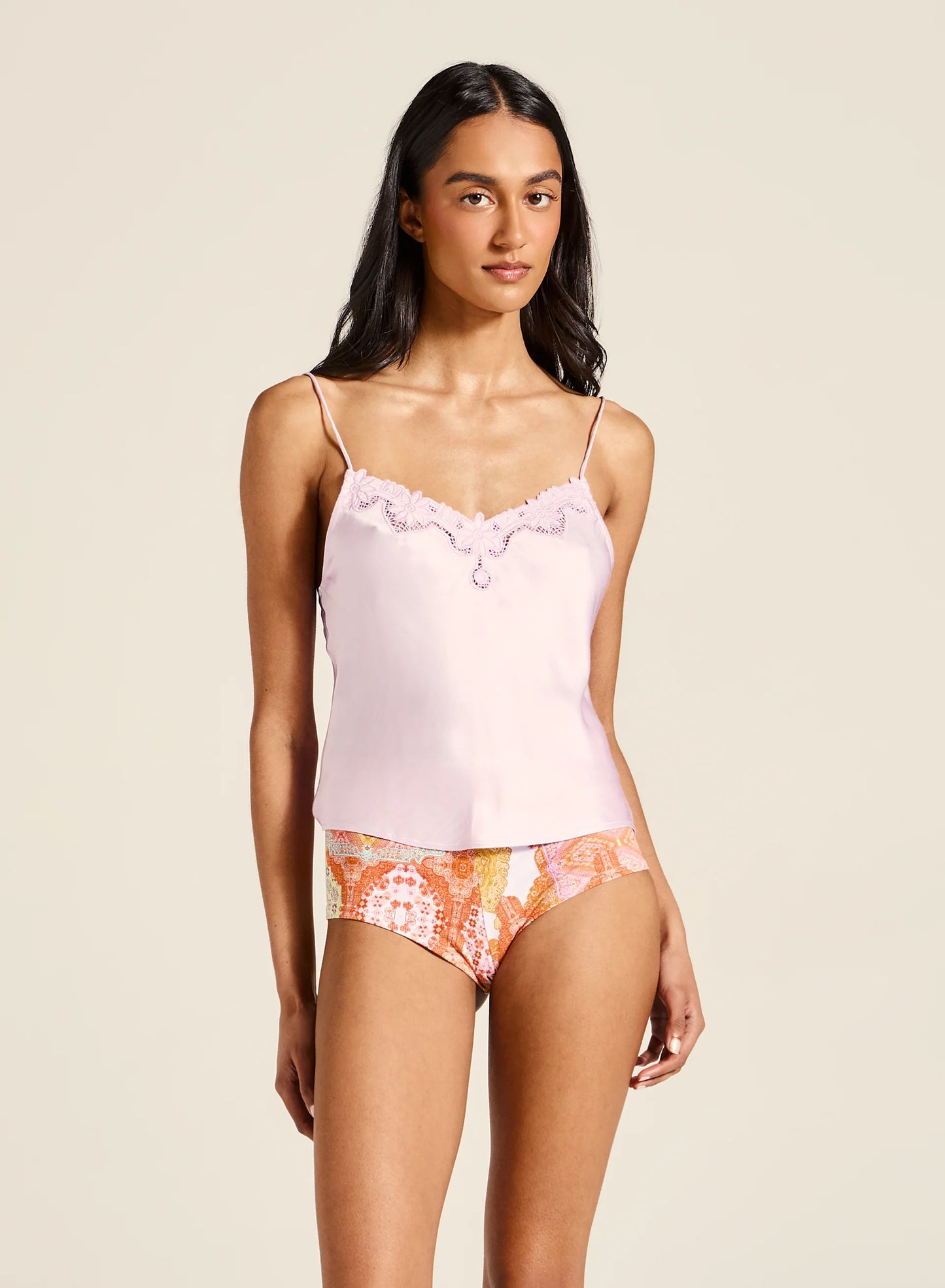 Tiger Lily -&nbsp;Meet the Kit Cami—an effortlessly elegant piece crafted with a soft V neckline, adjustable straps, and intricate embroidered detailing. Designed to drape beautifully with a luxurious handfeel, it brings a touch of timeless sophistication to any outfit. Pair with shorts or a floaty skirt for an ensemble that works from casual days to special summer moments.

Product Details:

Soft v neckline
Adjustable straps
Embroidery details
Delicate drape, luxe handfeel