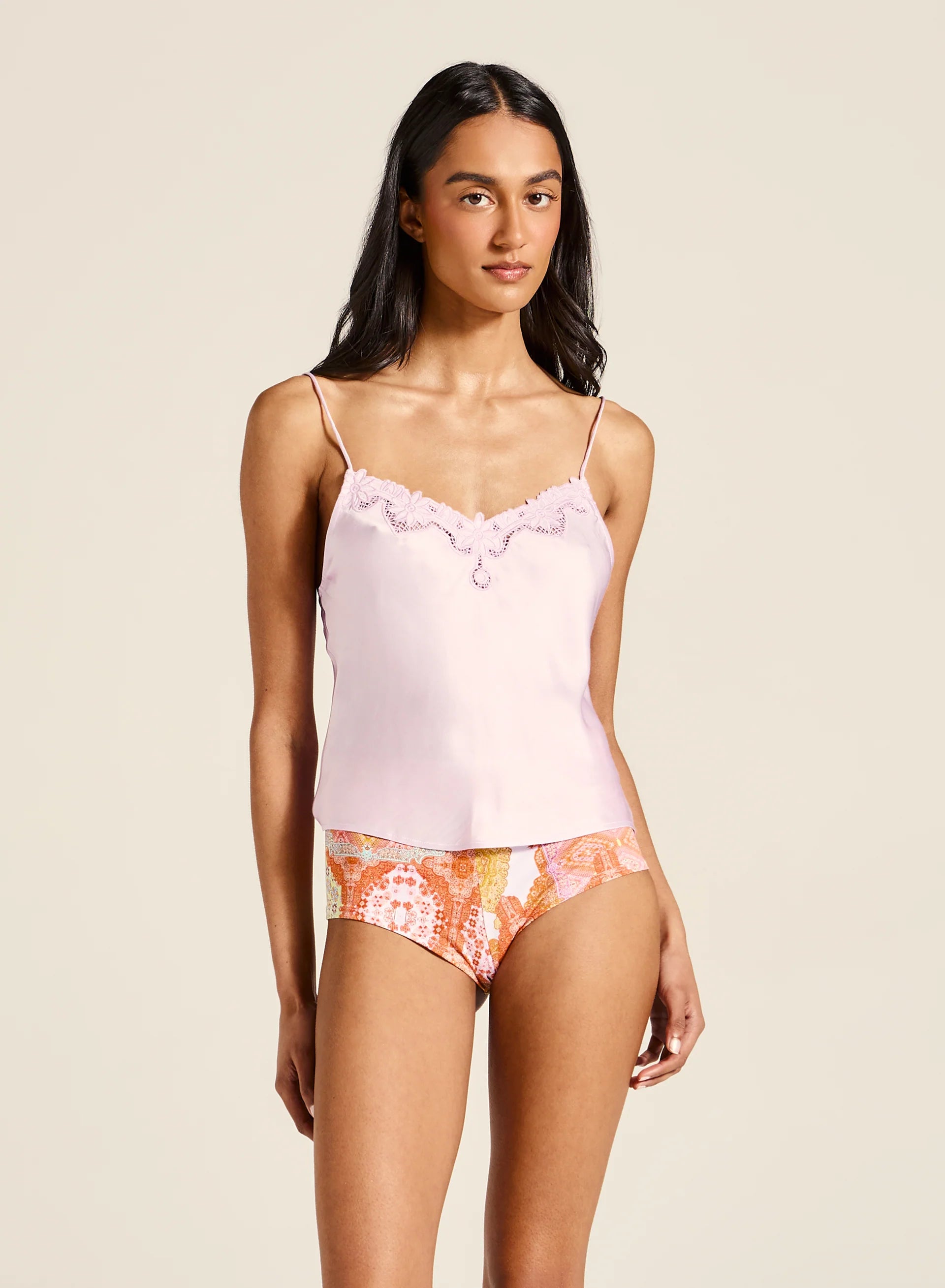 Tiger Lily -&nbsp;Meet the Kit Cami—an effortlessly elegant piece crafted with a soft V neckline, adjustable straps, and intricate embroidered detailing. Designed to drape beautifully with a luxurious handfeel, it brings a touch of timeless sophistication to any outfit. Pair with shorts or a floaty skirt for an ensemble that works from casual days to special summer moments.

Product Details:

Soft v neckline
Adjustable straps
Embroidery details
Delicate drape, luxe handfeel