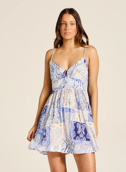 Crafted with an exquisite lace up design and intricate lace insert detailing, this strappy mini dress is sure to stand out. The fitted bodice and gathered skirt sculpt a flattering silhouette and ensure non-sheer coverage throughout.