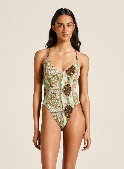 Featuring adjustable straps and high-cut legs that enhance your natural shape. With its cheeky cut and recycled fabrication, this swimsuit ensures you make a statement while lounging by the water, radiating confidence and charm.