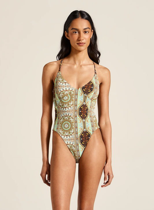 Featuring adjustable straps and high-cut legs that enhance your natural shape. With its cheeky cut and recycled fabrication, this swimsuit ensures you make a statement while lounging by the water, radiating confidence and charm.