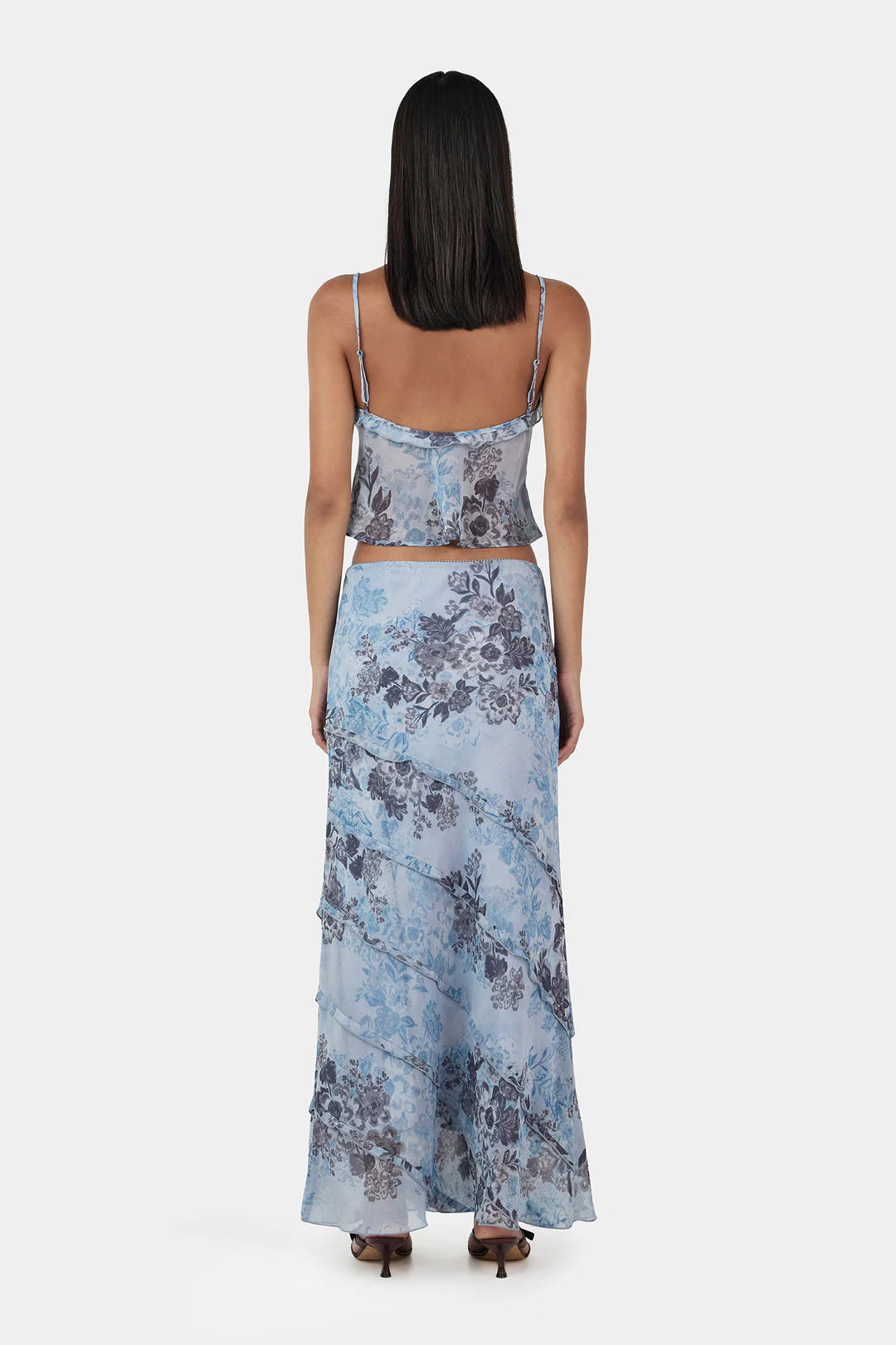 The Tiggy Camisole is a triangle cup cami top with gathers at the bust seam and a ruffled neckline. The Camisole has adjustable straps and a centre front keyhole. Designed to elevate any look.