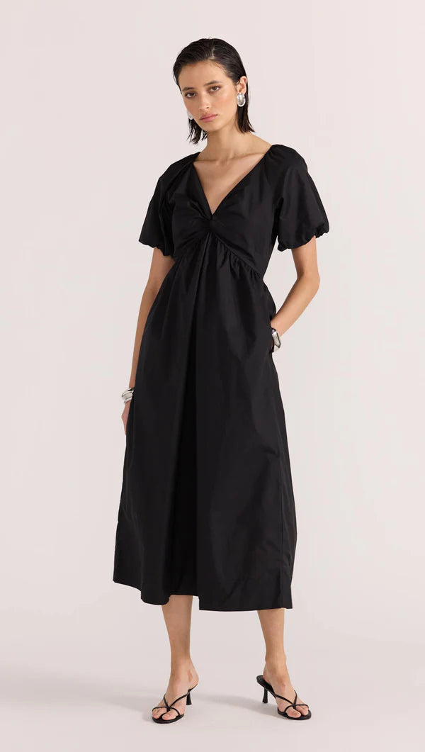 Update your LBD this season, with the new-in Ilana Twist Front Dress by Staple the Label. Featuring a knot design at the center front, short puffed sleeves, and a relaxed skirt shape. Pair with a barely there heel to complete the day to night look.