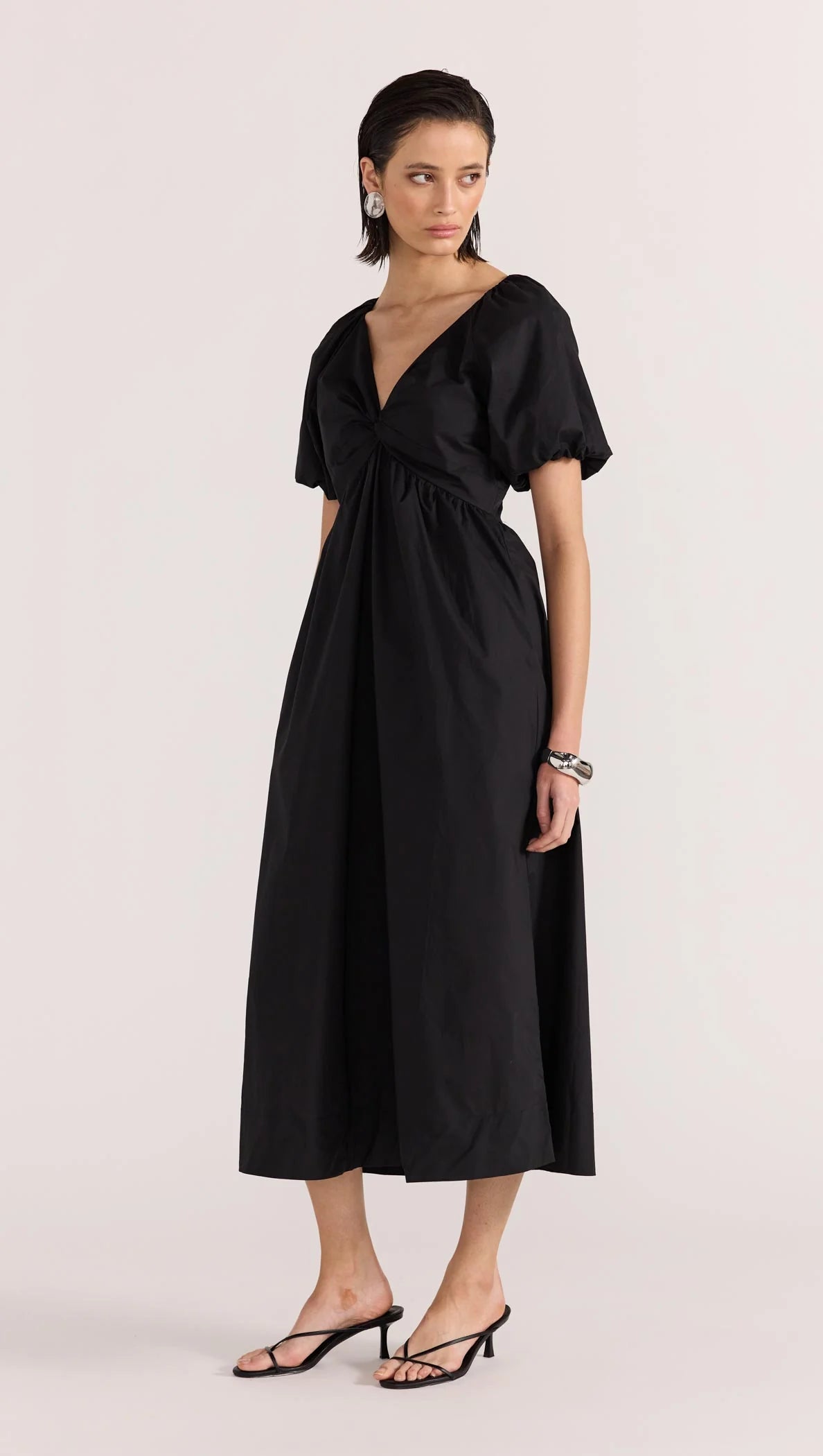 Update your LBD this season, with the new-in Ilana Twist Front Dress by Staple the Label. Featuring a knot design at the center front, short puffed sleeves, and a relaxed skirt shape. Pair with a barely there heel to complete the day to night look.