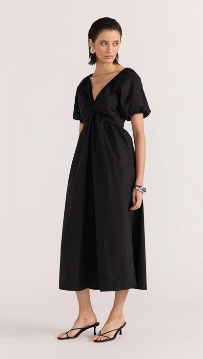 Update your LBD this season, with the new-in Ilana Twist Front Dress by Staple the Label. Featuring a knot design at the center front, short puffed sleeves, and a relaxed skirt shape. Pair with a barely there heel to complete the day to night look.