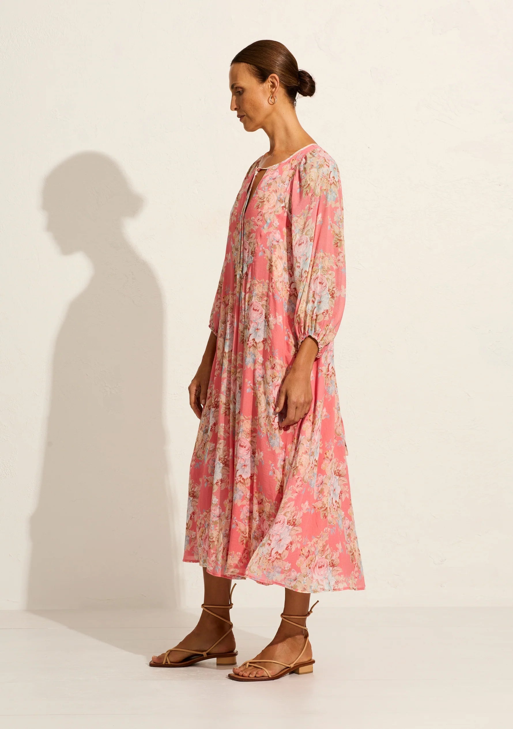 The Willow midi dress in our Bijoux floral in rose pink epitomises quintessential Auguste with its relaxed, floaty silhouette. It features an optional open-close neckline with tie detail, 3/4 elasticated sleeves, and an optional waist tie. Crafted from a silky cotton blend with a soft hand feel, it's an Auguste bestseller.