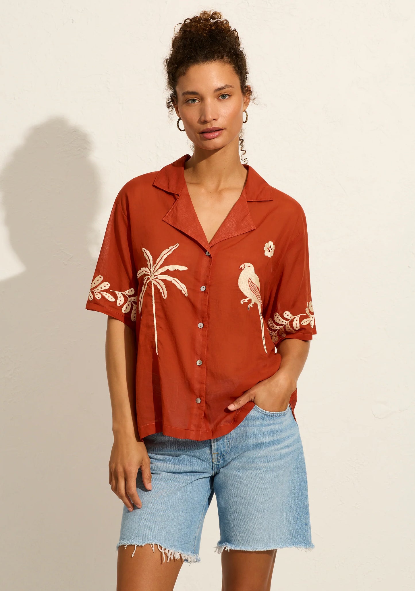 Introducing the Embroidered Rio Shirt in rust – our Balinese artisans have had some fun with this one! Channeling summer and all things quirky, this hand-embroidered masterpiece features a button front closure, notched collar, and is designed for an oversized fit. Made from 100% organic cotton.