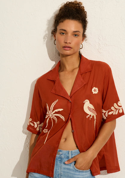 Introducing the Embroidered Rio Shirt in rust – our Balinese artisans have had some fun with this one! Channeling summer and all things quirky, this hand-embroidered masterpiece features a button front closure, notched collar, and is designed for an oversized fit. Made from 100% organic cotton.