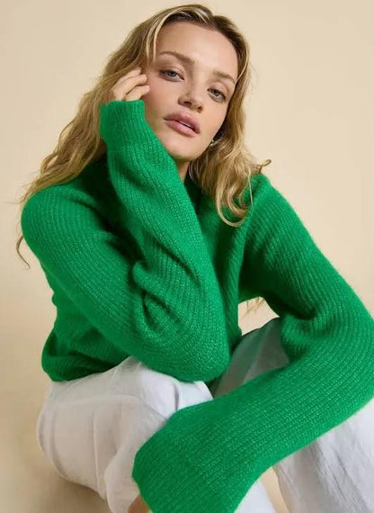 Add a pop of colour to your wardrobe with the Olivia Cardigan by Little Lies. Crafted in a vibrant fresh green hue, this timeless knit is designed with a slightly oversized fit for effortless layering and all-day comfort. Featuring a button-front closure with delicate shell buttons, it brings a touch of natural elegance to a classic silhouette.