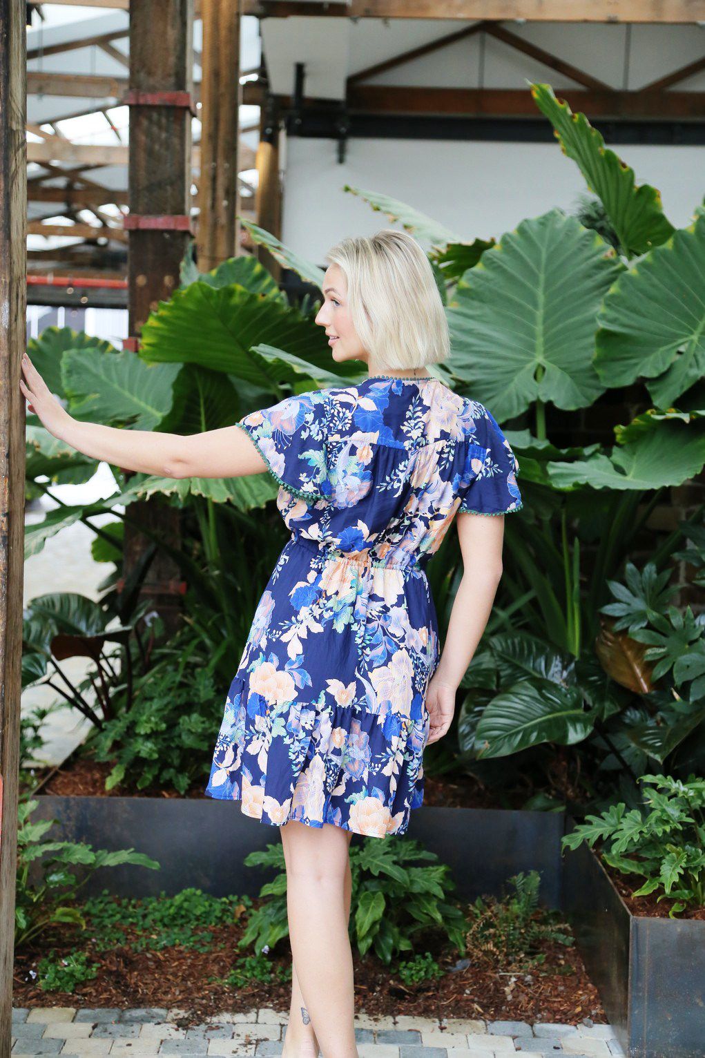 Playful, feminine, and effortlessly chic — the Bella Mini Boho Dress is your new go-to for carefree days and balmy nights. Designed with a flattering A-line silhouette, this mini features a vibrant floral print against a rich navy base, making it both eye-catching and versatile.