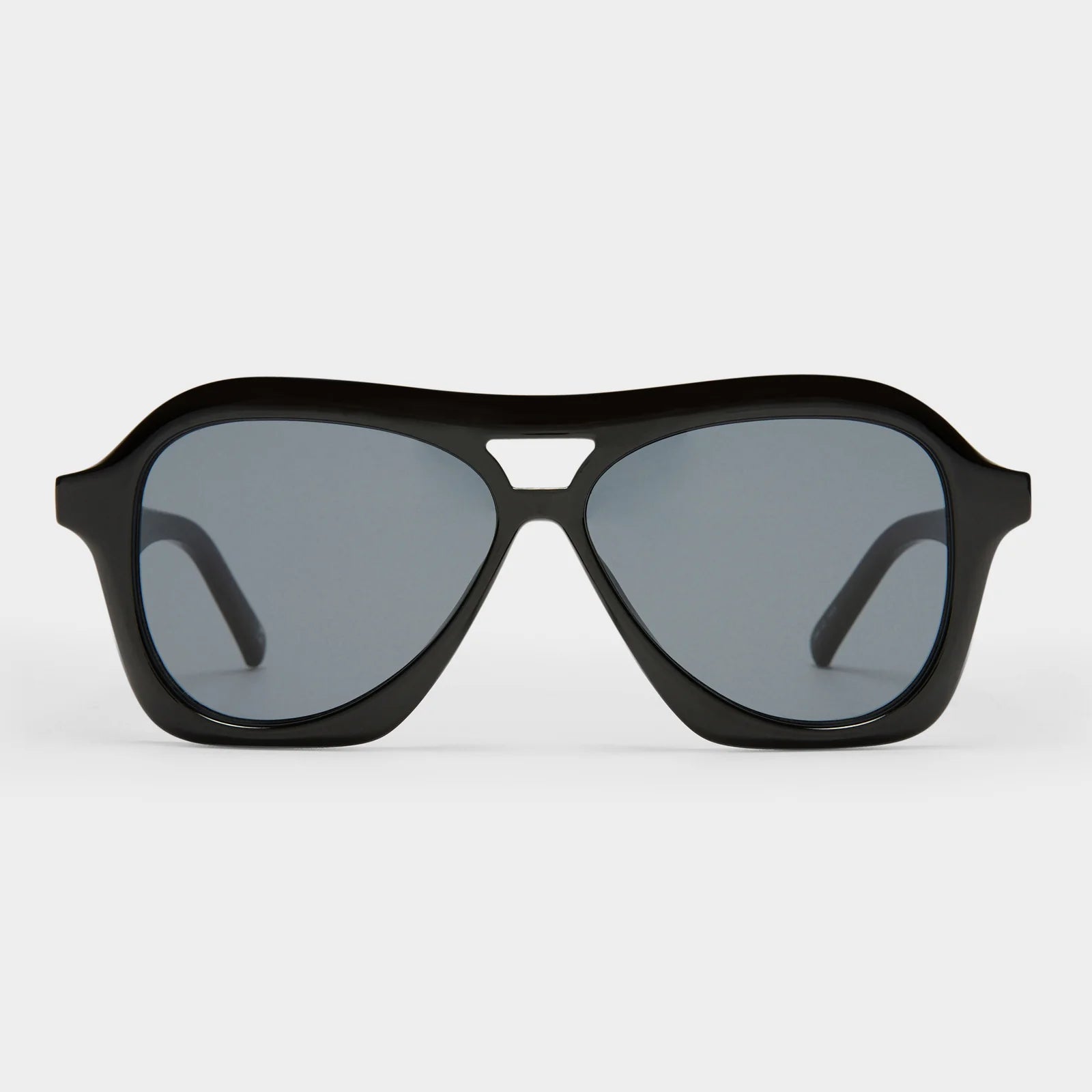 Inspired by millennial pop culture, our DRIZZLE sunglasses are the latest take on the classic aviator silhouette. Featuring a three-dimensional bevelled profile, this midsize frame offers flattering unisex proportions and is detailed with our understated pyramid stud hardware on both temples.

• Finished in classic black with dark lenses for an everyday look.
• Made using BPA free polymer plastic which is lightweight, durable and impact resistant.
• Fitted with shatterproof and scratch resistant polycarbona