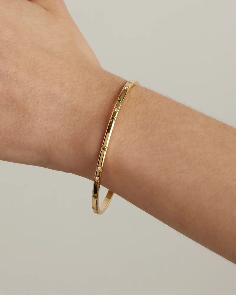 Our&nbsp;18k Gold Vermeil Depth of You Bangle&nbsp;draws inspiration from the profound depths of the sea, bringing a sense of calm as you look inward.&nbsp;Featuring a polished finish and encrusted with white and green&nbsp;cubic zirconia crystals&nbsp;in claw settings, this radiant bangle is&nbsp;the perfect eclectic addition to your bracelet stack.&nbsp; &nbsp;