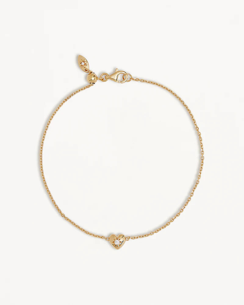A dainty heart design, set with a sparkling crystal,&nbsp;the&nbsp;Blooming Hearts Bracelet&nbsp;features&nbsp;our iconic lotus motif for new beginnings and love.&nbsp;Available in 18k gold vermeil.&nbsp;