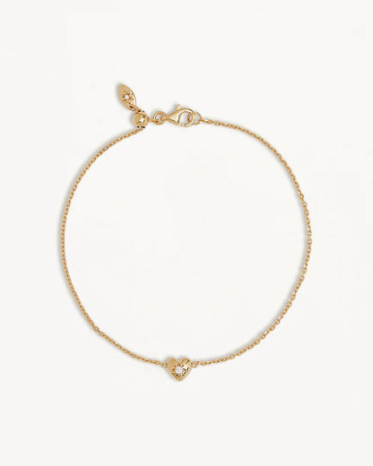 A dainty heart design, set with a sparkling crystal,&nbsp;the&nbsp;Blooming Hearts Bracelet&nbsp;features&nbsp;our iconic lotus motif for new beginnings and love.&nbsp;Available in 18k gold vermeil.&nbsp;