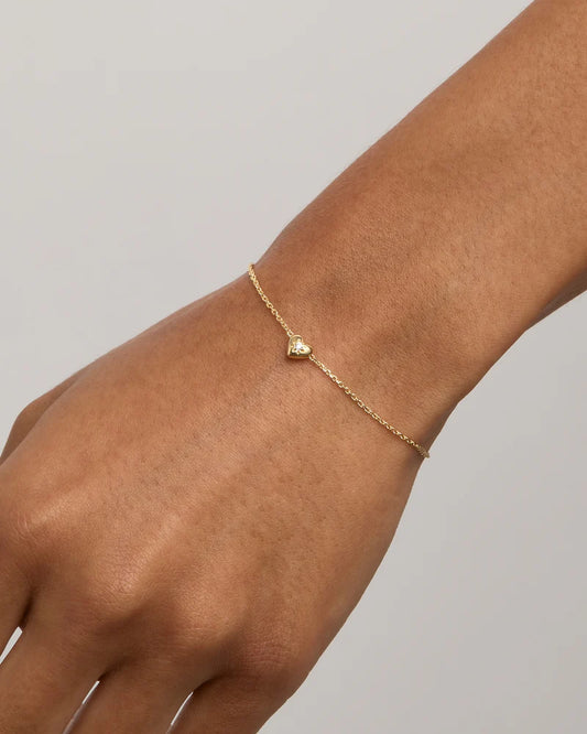 A dainty heart design, set with a sparkling crystal,&nbsp;the&nbsp;Blooming Hearts Bracelet&nbsp;features&nbsp;our iconic lotus motif for new beginnings and love.&nbsp;Available in 18k gold vermeil.&nbsp;