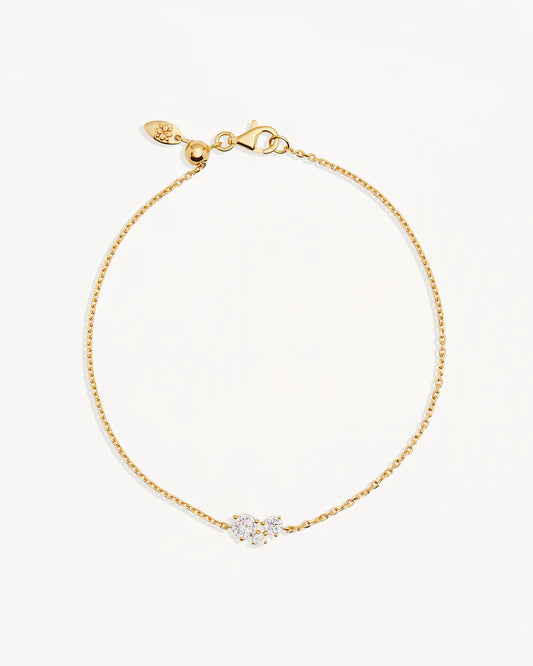 The&nbsp;Whispers of Love&nbsp;Bracelet&nbsp;features a classic trio design with an asymmetrical twist with varying sizes of round-cut crystals. This piece is a visual poem to the simplicity of love - and all the quiet magic it holds.&nbsp;It’s&nbsp;classic and delicate design is the perfect subtle touch of sparkle for the bride looking to shine in her own light.&nbsp;&nbsp;&nbsp;

Available in 18k gold vermeil and sterling silver.&nbsp;

2.5 microns of 18 carat gold coating a sterling silver base.&nbsp;
