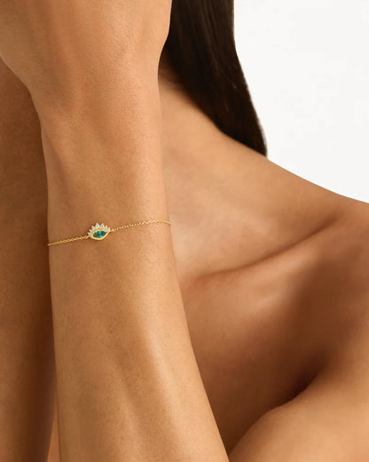 Breathe new life into the new year with the&nbsp;Hope and Protection Bracelet. Set with&nbsp;lab-grown blue Paraiba marquise-cut gemstone, our luminous evil eye will&nbsp;assist&nbsp;you in shedding all that does not serve you, allowing you to move into the new year with purpose and peace. This keepsake is perfect for gifting, traditionally gifted to imbue the wearer with luck and protection.&nbsp;