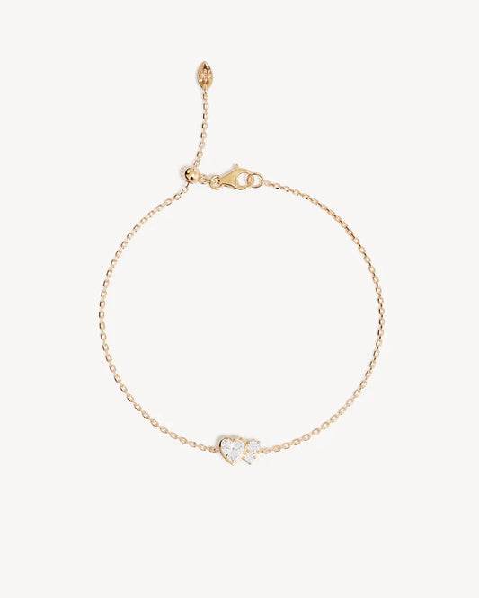 By Charlotte - The&nbsp;Dream&nbsp;Lover&nbsp;Heart&nbsp;Bracelet&nbsp;speaks to the unspoken connections and the in-between moments of utmost intimacy. The delicate heart cluster design encapsulates the&nbsp;dreamy&nbsp;moments of tender&nbsp;love&nbsp;and connections we hold closest to our hearts.&nbsp;

18k Gold Vermeil: 2.5 microns of 18 carat gold coating a sterling&nbsp;silver&nbsp;base.&nbsp;

Features heart (bezel setting)&nbsp;and round (claw) cut cubic&nbsp;zirconias.&nbsp;

Bracelet length: 19cm.