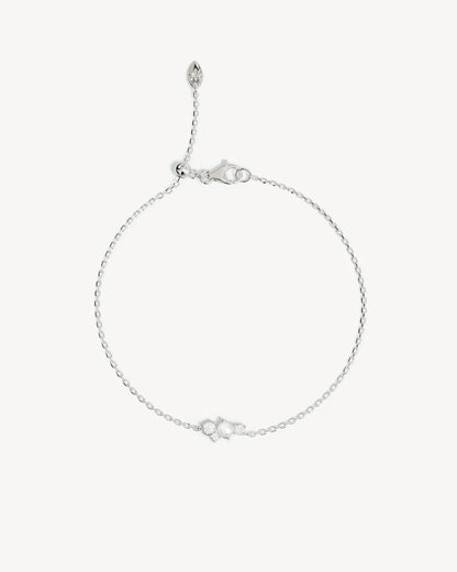 The Love in Stillness Pearl Bracelet celebrate those unseen moments - when we close our eyes to feel deeper, to connect beyond sight with love, with memory, with presence. This keepsake is an expression of romance in its softness and stillness.&nbsp;

18k Gold Vermeil: 2.5 microns of 18 carat gold coating a sterling silver base.&nbsp;

Delicate pearl cluster design.&nbsp;

Set with a round freshwater pearl and cubic zirconias in a claw setting.&nbsp;

Bracelet length: 19cm.&nbsp;

Features a silicon ball sl