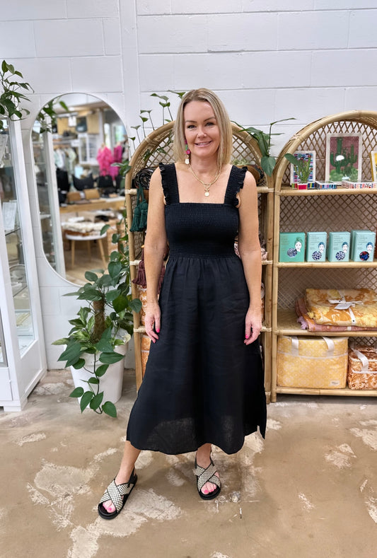 Goldie Dress by pops + Co is the perfect little black dress. Can be dressed up or down for any occasion. 100% linen, midi length, sheered bodest with thrill sleeve.  
