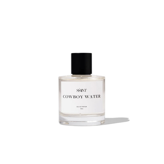 Step into the wild frontier with Cowboy Water. It's not just a scent; it's a rugged journey through the untamed West. Picture yourself on horseback, riding through a dusty trail by waters edge, with the scent of leather, cedar-wood, and campfire smoke lingering in the air.