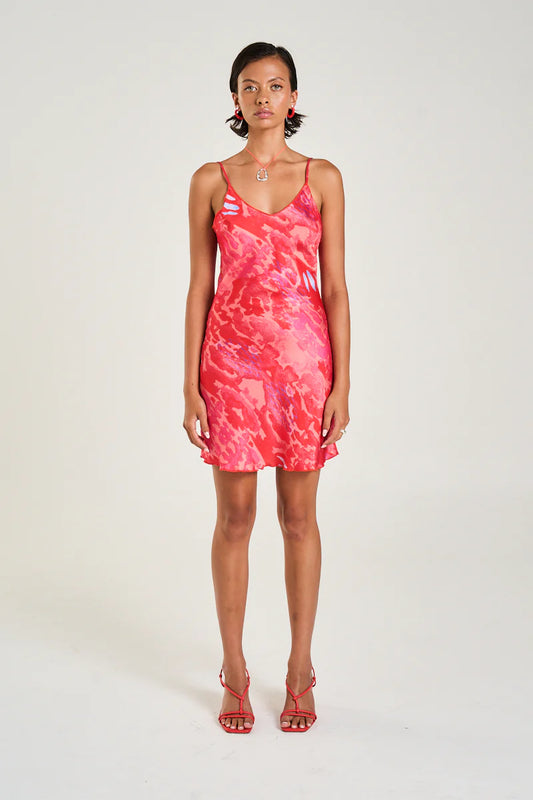 The Siren Mini Dress in Cycloid is a classic and timeless design with a V-neckline and adjustable straps falling elegantly just above the knee line.