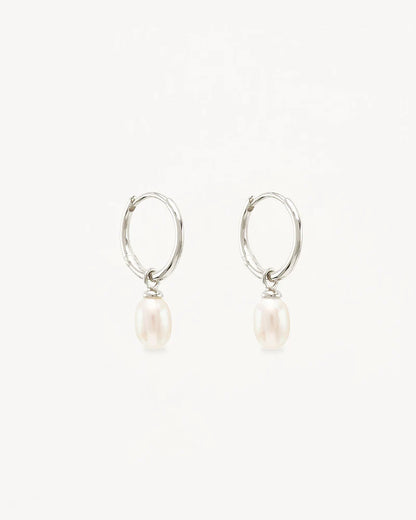 Find inner peace, balance and tranquillity with our&nbsp;Silver&nbsp;Live in Peace Hoops. This elevated take on the classic pearl earring is designed to inspire optimism and stillness, even amidst chaos.