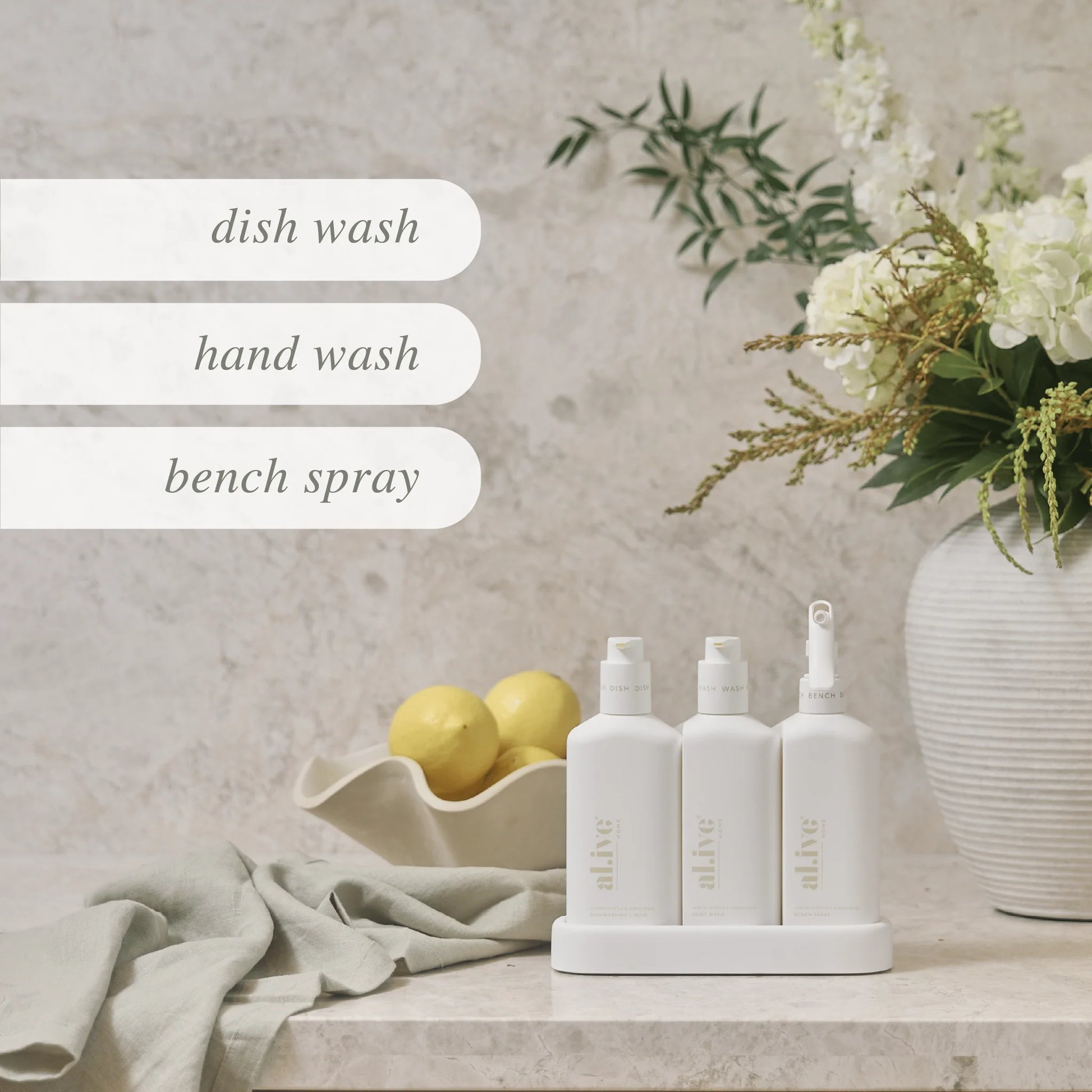 Elevate your kitchen experience with our Lemon Myrtle &amp; Honeydew Kitchen Trio in Crisp White. This set includes our Dishwashing Liquid, Bench Spray and Hand Wash, all conveniently nestled within a beautifully designed custom tray to enhance your kitchen countertop.