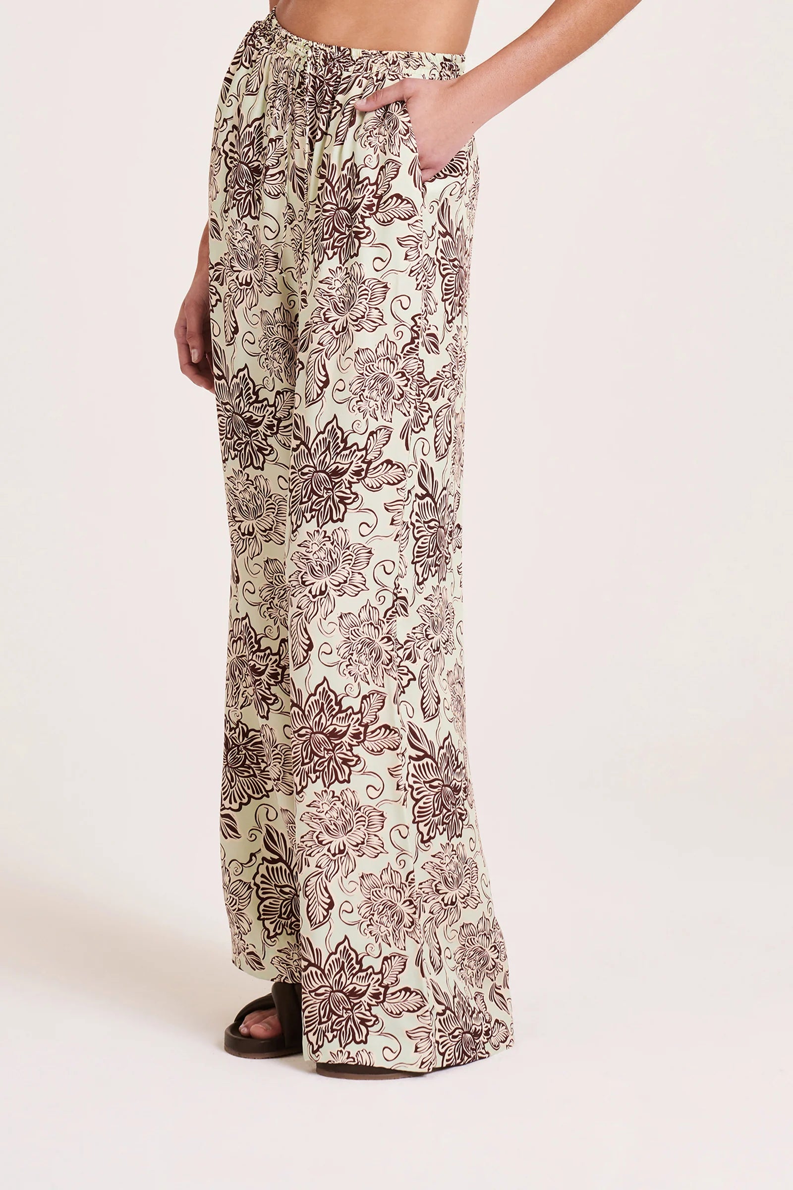 The Misi Cupro Pant is made from our signature cupro fabrication in our exclusive Castillo print. The silhouette is a relaxed wide leg, full length pant. Features include a an elasticated waistband with a drawstring, side seam pockets and two back patch pockets.