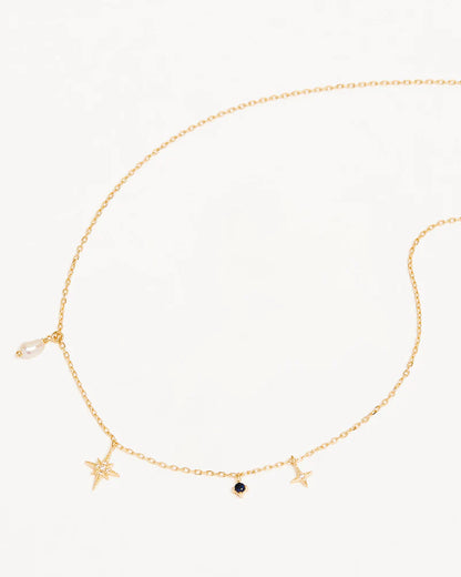 Layer yourself in the heavens with our&nbsp;Stardust Choker, a delicate adornment that weaves together each beautifully unique element of the night sky. Our choker features a Freshwater Pearl which symbolises the illuminating moonlight, a divine Sapphire for the infinite night sky, and two crystal encrusted Stars for the celestial bodies that eternally guide us.