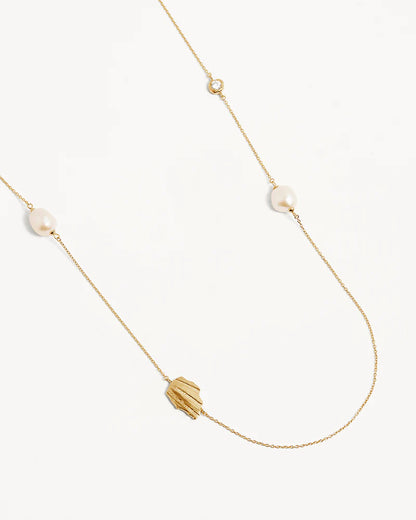 Our&nbsp;18k Gold Vermeil Moonlit Tides Necklace&nbsp;honours the relationship between the divine moon and the ocean.&nbsp;Set with a sparkling&nbsp;crystal&nbsp;and baroque freshwater pearls, this necklace can be worn wrapped around twice for a double layered necklace look.&nbsp;Just as the&nbsp;moon rules the tides of the sea,&nbsp;feel inspired to embrace&nbsp;your&nbsp;divine power.&nbsp;&nbsp;