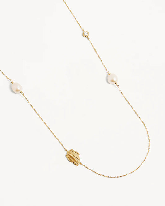 Our&nbsp;18k Gold Vermeil Moonlit Tides Necklace&nbsp;honours the relationship between the divine moon and the ocean.&nbsp;Set with a sparkling&nbsp;crystal&nbsp;and baroque freshwater pearls, this necklace can be worn wrapped around twice for a double layered necklace look.&nbsp;Just as the&nbsp;moon rules the tides of the sea,&nbsp;feel inspired to embrace&nbsp;your&nbsp;divine power.&nbsp;&nbsp;
