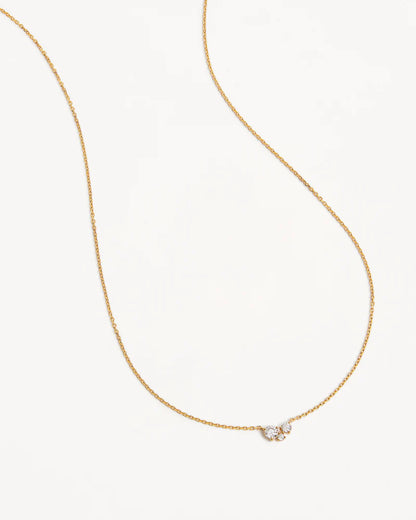 The&nbsp;Whispers of Love Necklace&nbsp;features a classic trio design with an asymmetrical twist&nbsp;with&nbsp;varying sizes of round-cut crystals.&nbsp;This piece is a&nbsp;visual poem to the simplicity of love - and all the quiet magic it holds.&nbsp;It’s&nbsp;classic and delicate design&nbsp;is the perfect subtle touch of sparkle for the&nbsp;bride&nbsp;looking to shine in her own light.&nbsp;