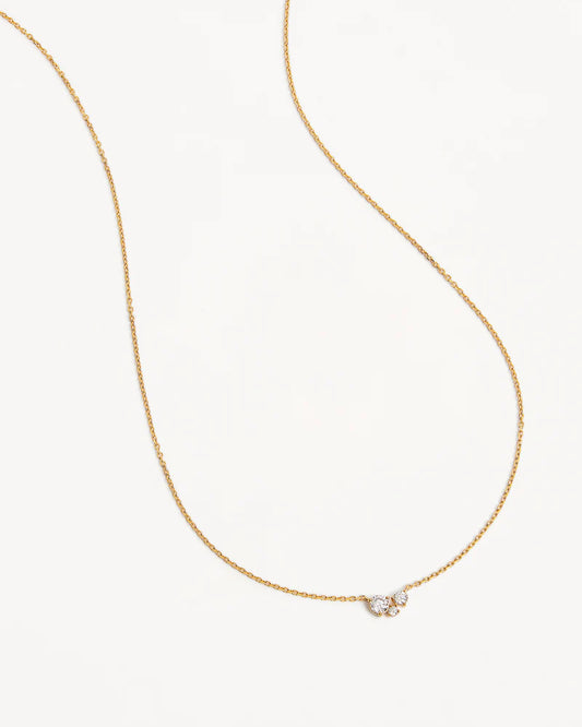 The&nbsp;Whispers of Love Necklace&nbsp;features a classic trio design with an asymmetrical twist&nbsp;with&nbsp;varying sizes of round-cut crystals.&nbsp;This piece is a&nbsp;visual poem to the simplicity of love - and all the quiet magic it holds.&nbsp;It’s&nbsp;classic and delicate design&nbsp;is the perfect subtle touch of sparkle for the&nbsp;bride&nbsp;looking to shine in her own light.&nbsp;