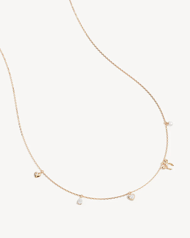 The Forever Yours Charm Choker is a reminder to embrace love in all its forms; its depth, stillness and radiance. This playful, feminine and delicate charm design is perfect for layering back with your favourite By Charlotte styles. &nbsp;

18k Gold Vermeil: 2.5 microns of 18 carat gold coating a sterling silver base.&nbsp;

Necklace length: 16 inches (40.64cm).&nbsp;

Features a silicon ball slider to customise length.