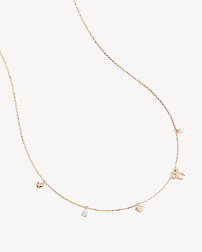 The Forever Yours Charm Choker is a reminder to embrace love in all its forms; its depth, stillness and radiance. This playful, feminine and delicate charm design is perfect for layering back with your favourite By Charlotte styles. &nbsp;

18k Gold Vermeil: 2.5 microns of 18 carat gold coating a sterling silver base.&nbsp;

Necklace length: 16 inches (40.64cm).&nbsp;

Features a silicon ball slider to customise length.
