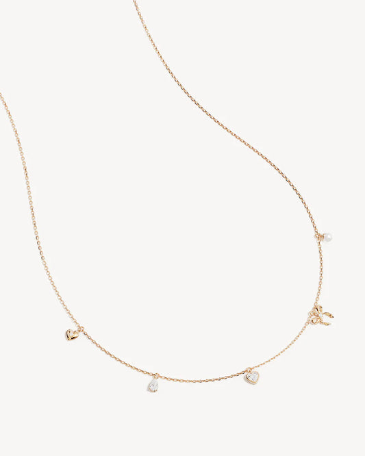 The Forever Yours Charm Choker is a reminder to embrace love in all its forms; its depth, stillness and radiance. This playful, feminine and delicate charm design is perfect for layering back with your favourite By Charlotte styles. &nbsp;

18k Gold Vermeil: 2.5 microns of 18 carat gold coating a sterling silver base.&nbsp;

Necklace length: 16 inches (40.64cm).&nbsp;

Features a silicon ball slider to customise length.