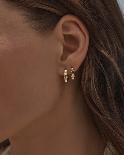 Breathe new life into the new year with the&nbsp;Hope and Protection Hoops.&nbsp;Set with&nbsp;cubic&nbsp;zirconias&nbsp;and lab-grown opals, our luminous evil eye will&nbsp;assist&nbsp;you in shedding all that does not serve you, allowing you to move into the new year with purpose and peace. This keepsake is perfect for gifting, traditionally gifted to imbue the wearer with luck and protection.&nbsp;