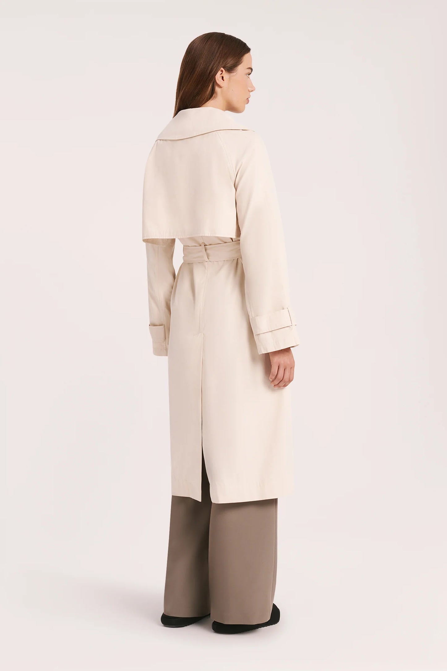 The Odyssey Trench coat is made from a sturdy cotton nylon blend with a peached/sueded finish. Fit is relaxed with wide full length sleeves &amp; body length finishing at knee level. Features include traditional trench coat detailing, double breasted button opening, waist tie &amp; storm flap.&nbsp;