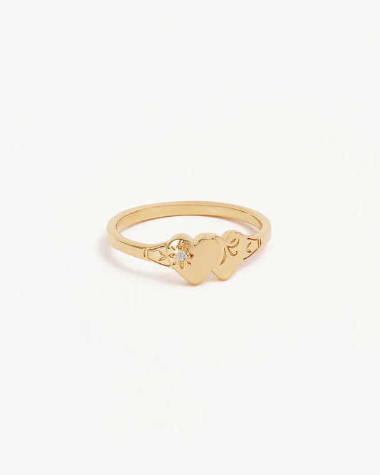 Vintage and keepsake&nbsp;inspired,&nbsp;the&nbsp;Forever Intertwined Heart Signet Ring&nbsp;features a&nbsp;traditional engraving detailing with a lotus bloom twist. A nostalgic design that reminds us of the bonds that are forever embedded in our hearts and the memories that will forever connect us.&nbsp;Available in 18k gold vermeil and&nbsp;925&nbsp;sterling silver.&nbsp;&nbsp;