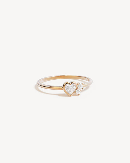 By Charlotte - The Dream Lover Heart Ring speaks to the unspoken connections and the in-between moments of utmost intimacy. The delicate heart cluster design encapsulates the dreamy moments of tender love and connections we hold closest to our hearts.&nbsp;

18k Gold Vermeil: 2.5 microns of 18 carat gold coating a sterling silver base.&nbsp;

Features heart (bezel setting) and round (claw) cut cubic zirconias.&nbsp;

Cluster design: 7 x 5mm.&nbsp;

Band height: 1.2mm.&nbsp;

Polished finish.&nbsp;