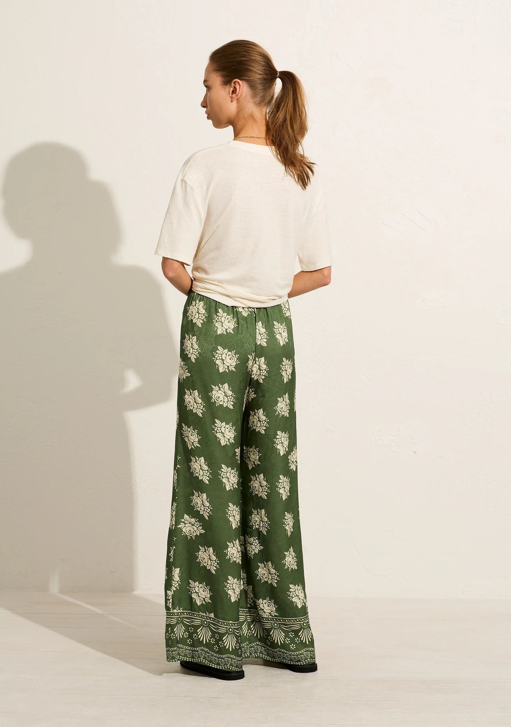The Shyla Pant is crafted from viscose jacquard with a silky floral finish. In our green Mabel print with a contrast border print cuff, this style offers a high-rise fit, an elasticated waistband with a functional drawcord and a wide-leg design
