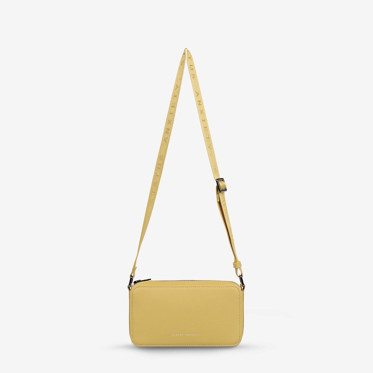 A state of delirium can be brought on by many things, and it usually comes on fast. With its branded web strap and compact structured shape, 'Delirium' is made for making tracks no matter what state of mind you find yourself in.

Soft shrunken pebble leather
Custom Status Anxiety lining
Back slider pocket
Internal zipper pocket, and open pouch pockets
Zipper close
Comes in a Status Anxiety soft material drawstring bag