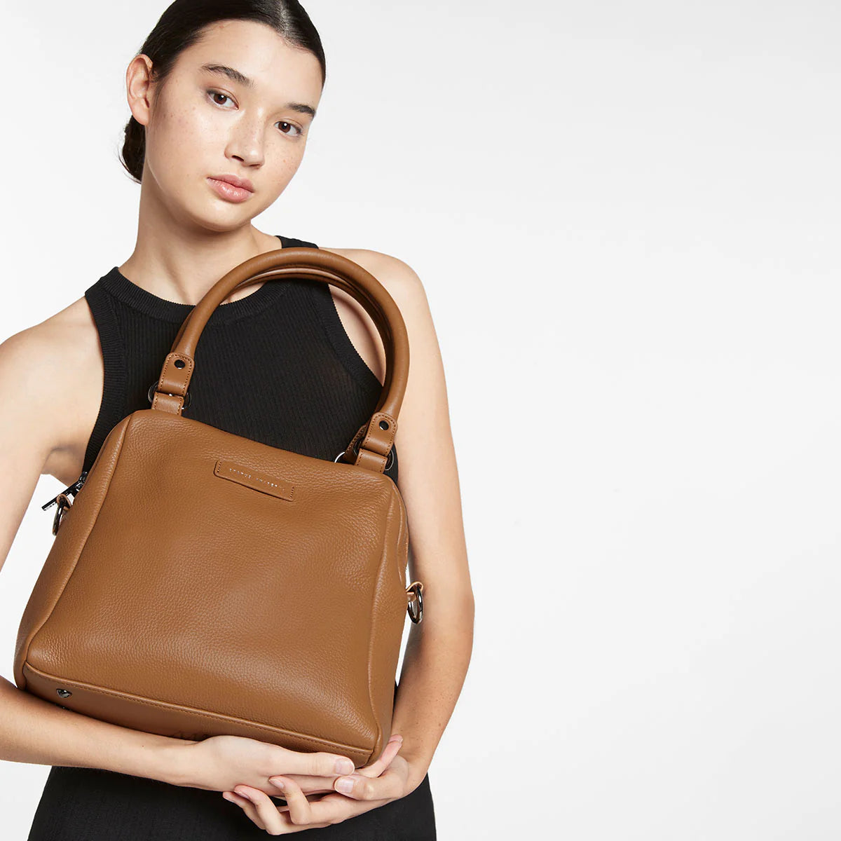 The final assault to end it, to prevail over the proclivity to someone or something. The Last Mountains handbag with its taller silhouette is the perfect day to night companion and can be worn over elbow, shoulder or body (with long strap). Features a wide-opening main compartment, longer shoulder straps for added comfort and secret magnet-close pocket on the outside for your phone etc.

Soft shrunken pebble leather
Custom Status Anxiety lining
Back magnet pocket
Internal zipper pocket, and open pouch pocke