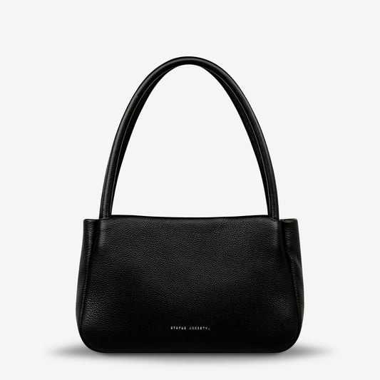 If you think about something in the cold light of day, you think about it clearly and calmly without emotion. In much the same way, the 'Light of Day' handbag isn't caught up with unnecessary, over the top design features. With its more structured form and thoughtful simplicity the LOD bag makes for the perfect day to night bag. With generous straps it can be comfortably worn over the shoulder or elbow and features a wide opening main compartment, with zipper pocket, open pockets, and clip for your keys.
