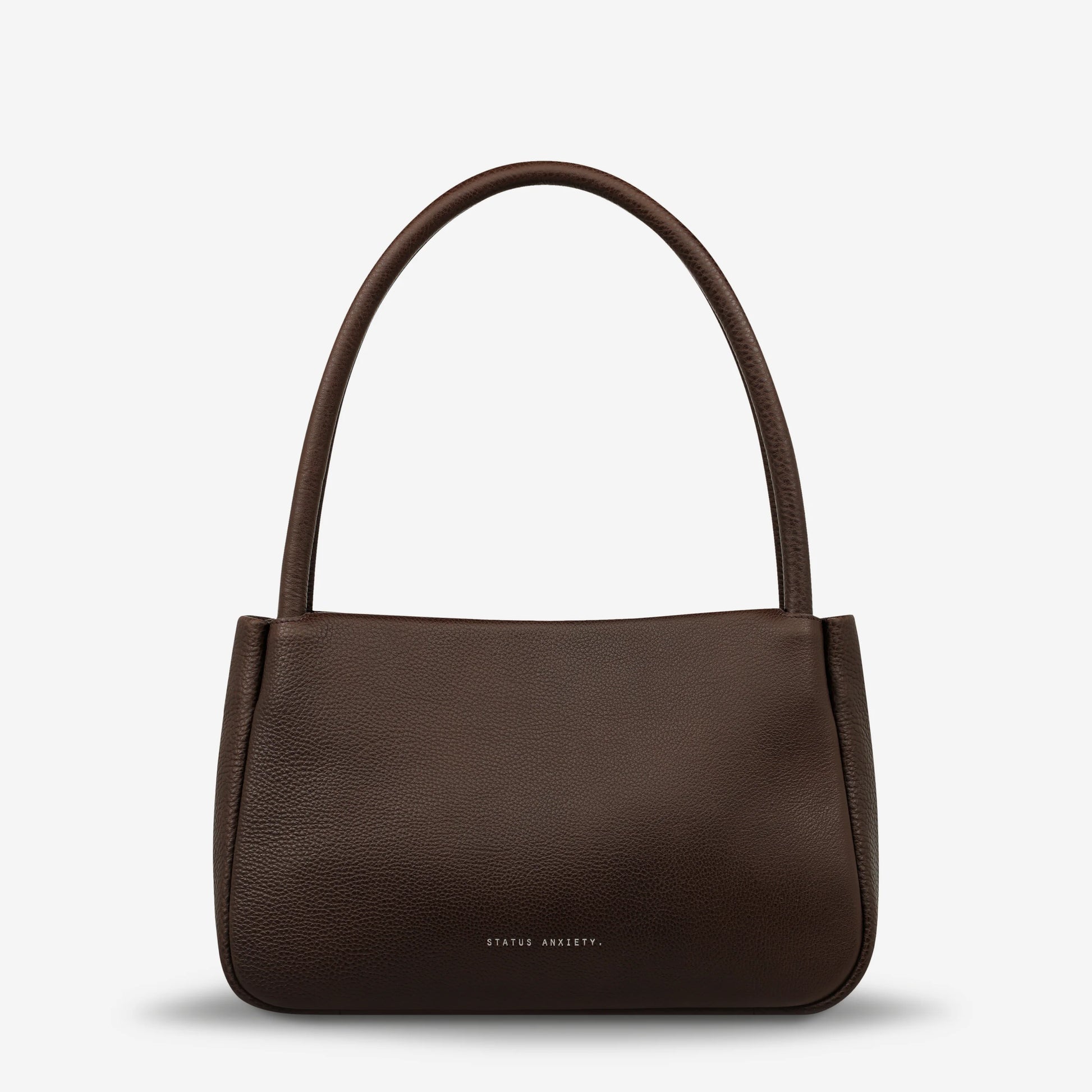 If you think about something in the cold light of day, you think about it clearly and calmly without emotion. In much the same way, the 'Light of Day' handbag isn't caught up with unnecessary, over the top design features. With its more structured form and thoughtful simplicity the LOD bag makes for the perfect day to night bag. With generous straps it can be comfortably worn over the shoulder or elbow and features a wide opening main compartment, with zipper pocket, open pockets, and clip for your keys.