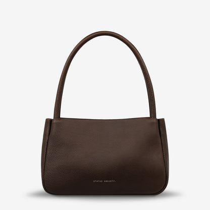 If you think about something in the cold light of day, you think about it clearly and calmly without emotion. In much the same way, the 'Light of Day' handbag isn't caught up with unnecessary, over the top design features. With its more structured form and thoughtful simplicity the LOD bag makes for the perfect day to night bag. With generous straps it can be comfortably worn over the shoulder or elbow and features a wide opening main compartment, with zipper pocket, open pockets, and clip for your keys.
