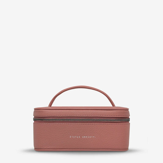 A nifty little case for all your precious personal stuff, such as necklaces, rings, earrings, watches, bracelets etc. The easy snap button straps will keep your rings / earrings neatly arranged on the top flap and throw larger items into the main compartment.