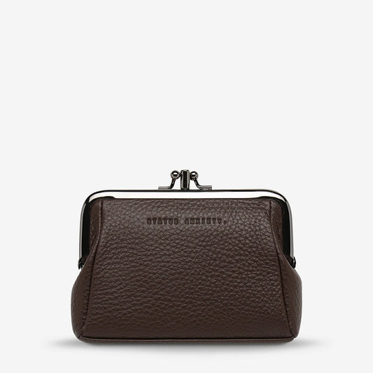 It was only a matter of time, wasn't it? Made for frivolous outings, the Volatile clasp frame purse is the new throw and go purse. Perfect for carrying cards, cash, lip gloss and the like.

Soft shrunken pebble leather
Custom Status Anxiety lining
Frame clasp close
Gunmetal hardware
Blind embossed logo
Comes in a Status Anxiety branded drawstring bag